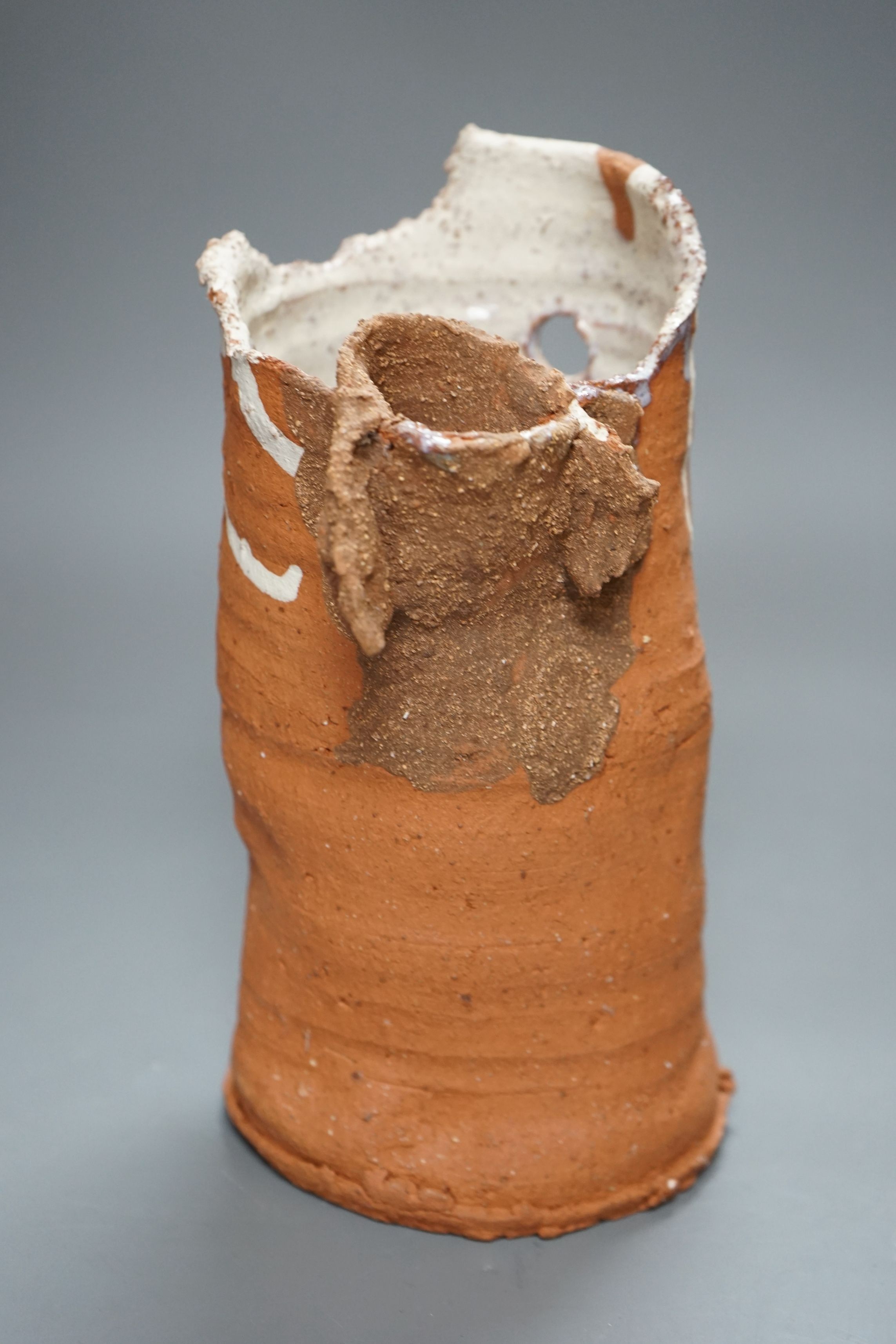 Peter Smith, a thrown terracotta cylindrical vessel with white glaze to the interior and brown nose vessel, with original purchase receipt, impressed mark to base rim, 26.5cm tall
